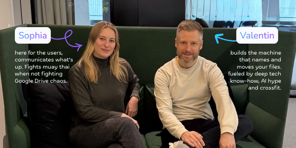 Sophia and Valentin, the two founders of Filently, on a green sofa. Sophia is here for the users and communicates what is up; Valentin builds the machine that names and moves your files.